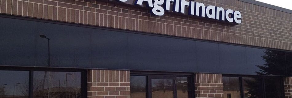 An aluminum business sign boardsbefore store front