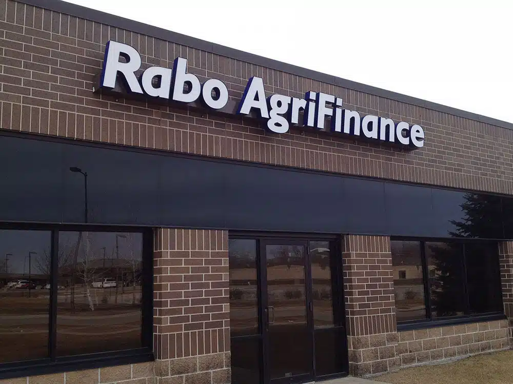 An aluminum business sign boardsbefore store front