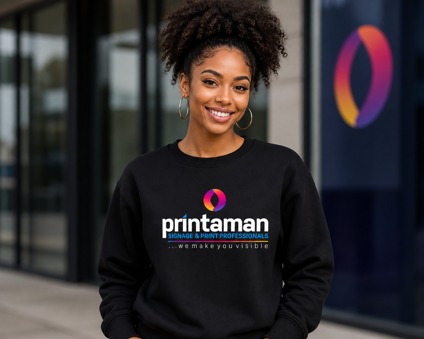 Black Sweater With Printaman's logo at the front